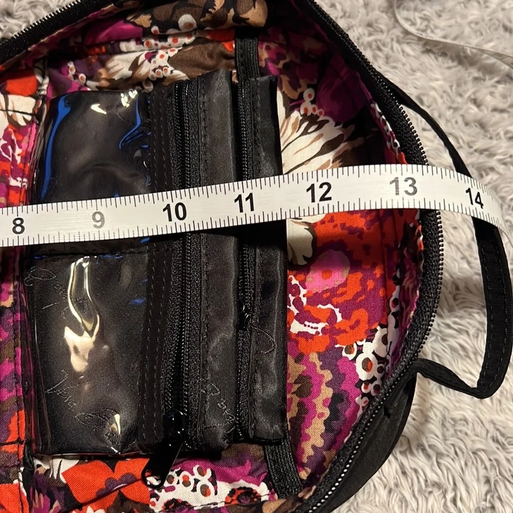 Vera Bradley black toiletry bag with 4 zippered pockets inside. Great condition!